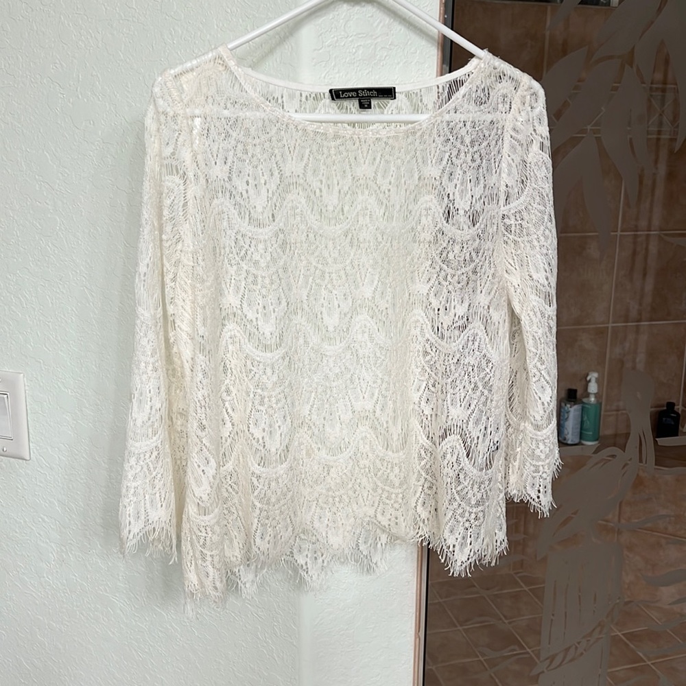 A sheer top. It is medium. Purchased at one of the Disney clothing stores.
